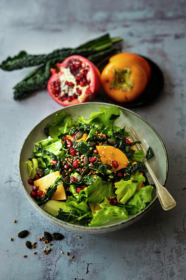 Autumn Salad With Cabbage, Batavia Lettuce, Persimmon And Pomegranate vegan Photograph by Jan Wischnewski