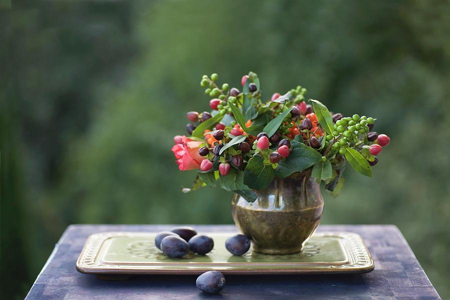 Autumn Still-life Arrangement With Posy Of Berries In Brass Vase And Plums On Tray Photograph by Alicja Koll