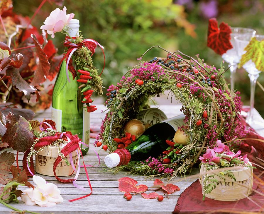 Autumn Table Decoration: Moss, Erica And Ornamental Peppers Photograph by Friedrich Strauss