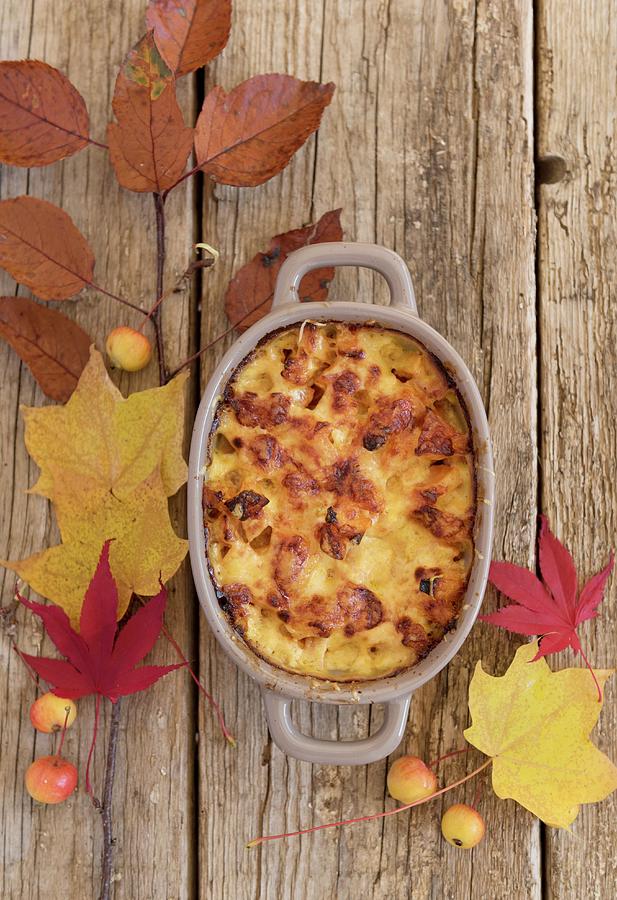 Autumnal Pumpkin Gratin In A Baking Dish Photograph by Sonia Chatelain