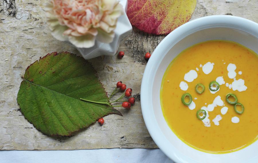 Autumnal Pumpkin Soup With Chilli Rings Photograph by Alexandra Feitsch