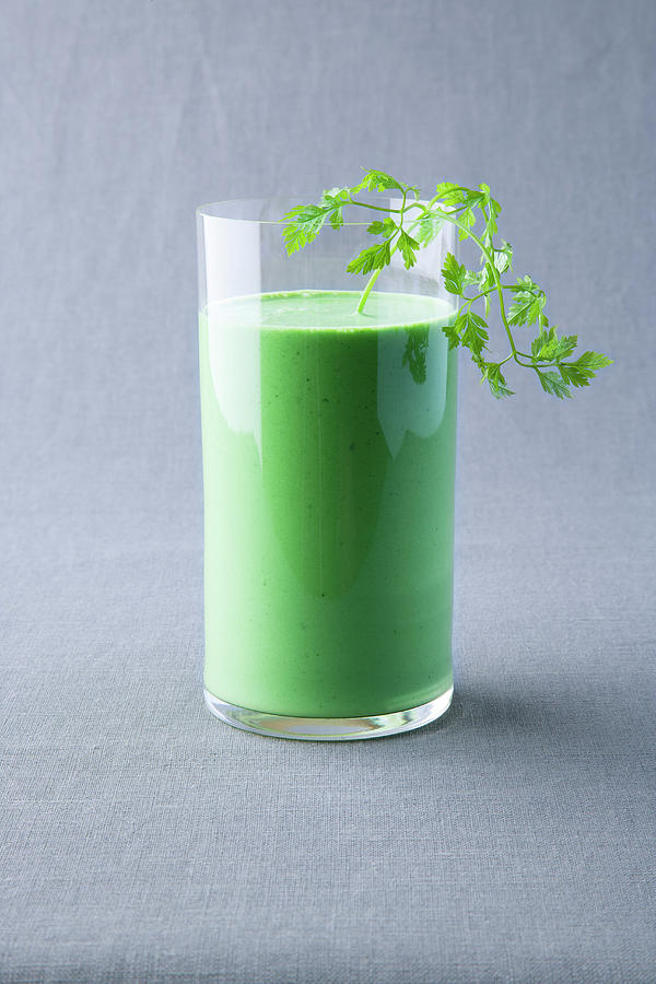 Avocado And Coriander Smoothie Photograph by Michael Wissing