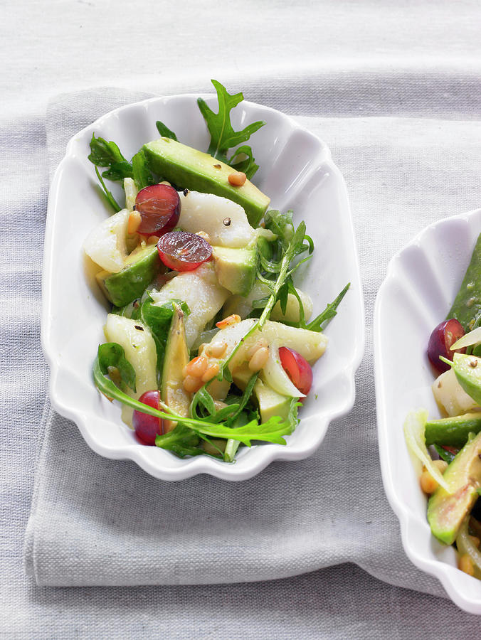 Avocado And Pear Salad With Rocket, Pine Nuts And Grapes Photograph by Barbara Lutterbeck
