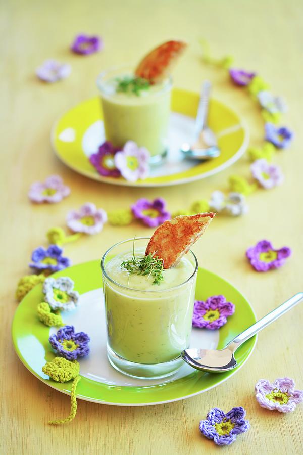Avocado Soup In Two Glasses With Toast And Fresh Cress, And Decorative Crochet Spring Flowers Photograph by Mariola Streim