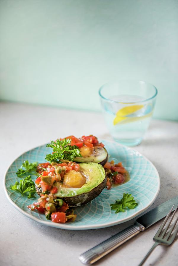 Avocado With Baked Egg And Salsa Photograph by Magdalena Hendey