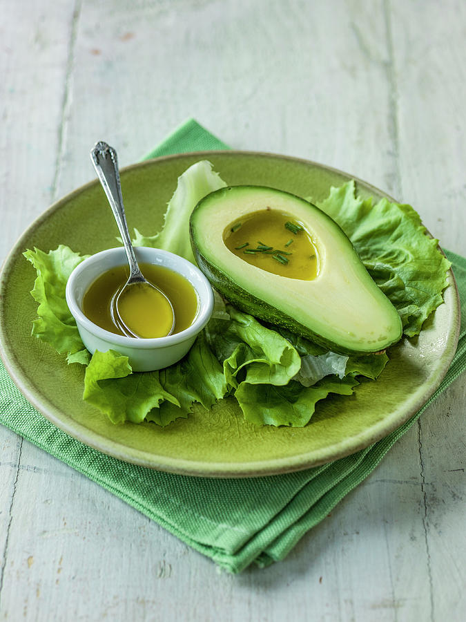 Avocado With Vinaigrette Dressing And Chives Ona Bed Of Lettuce Photograph by Michael Paul