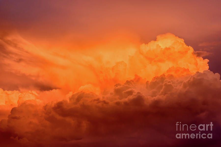 Awesome sunset, red orange cumulus clouds are towering in this dramatic evening sky Photograph by Ulrich Wende