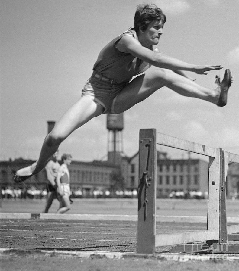 Babe Didrickson Jumping Over Hurdle Photograph by Bettmann