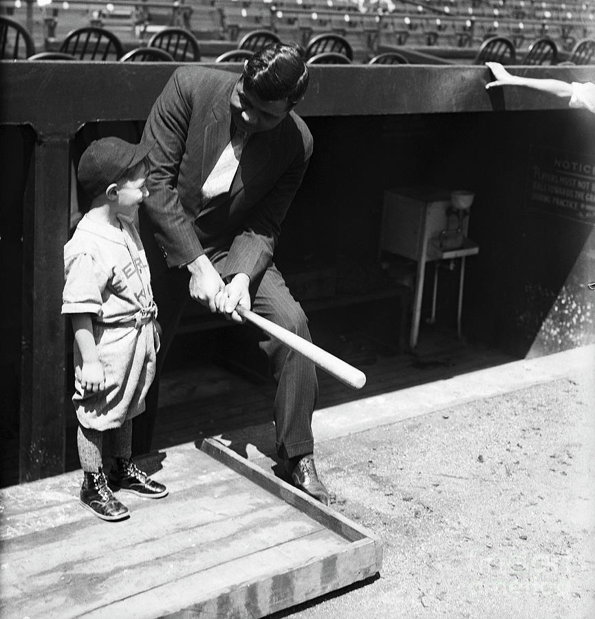 Babe Ruth Showing Boy How To Hold Bat by Bettmann