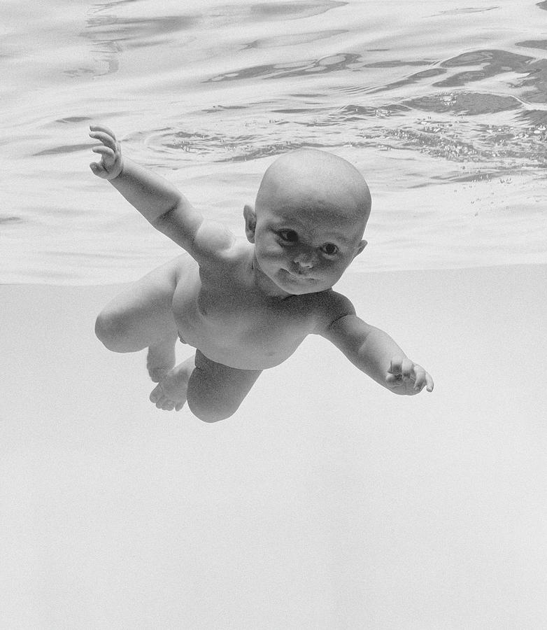 black baby swimming underwater