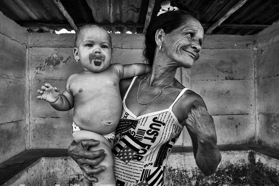 Baby And Mother Photograph by Carlos Lopes Franco