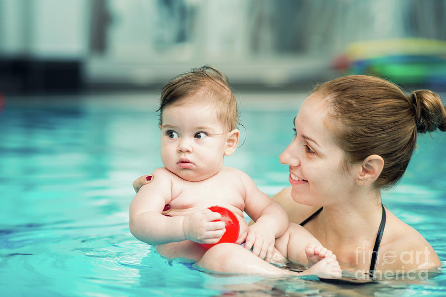 Ball Photograph - Baby And Mother In Swimming Pool by Microgen Images/science Photo Library