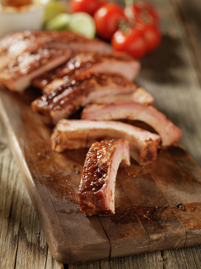 Baby Back Pork Ribs On A Cutting Board Photograph by Lauripatterson