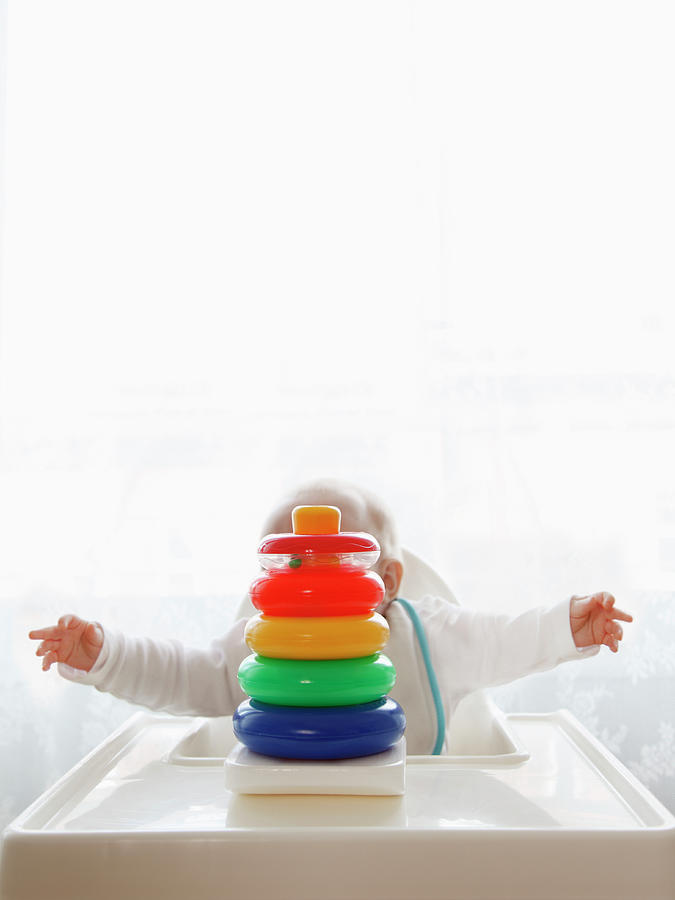 Baby Behind Stacking Rings Photograph by Lynn James Baby Behind Stacking Rings Photograph by Lynn James