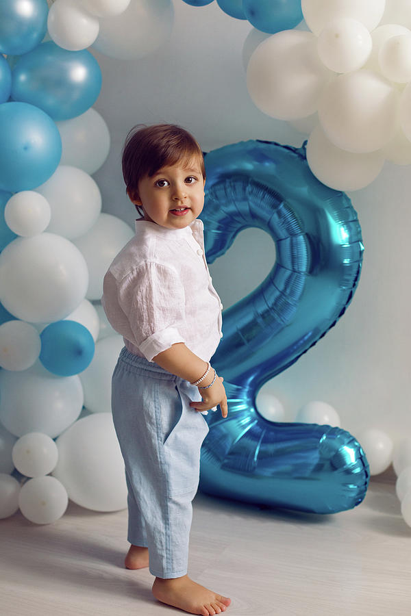Baby Boy In Blue Pants And Shirt Standing On The Floor Photograph