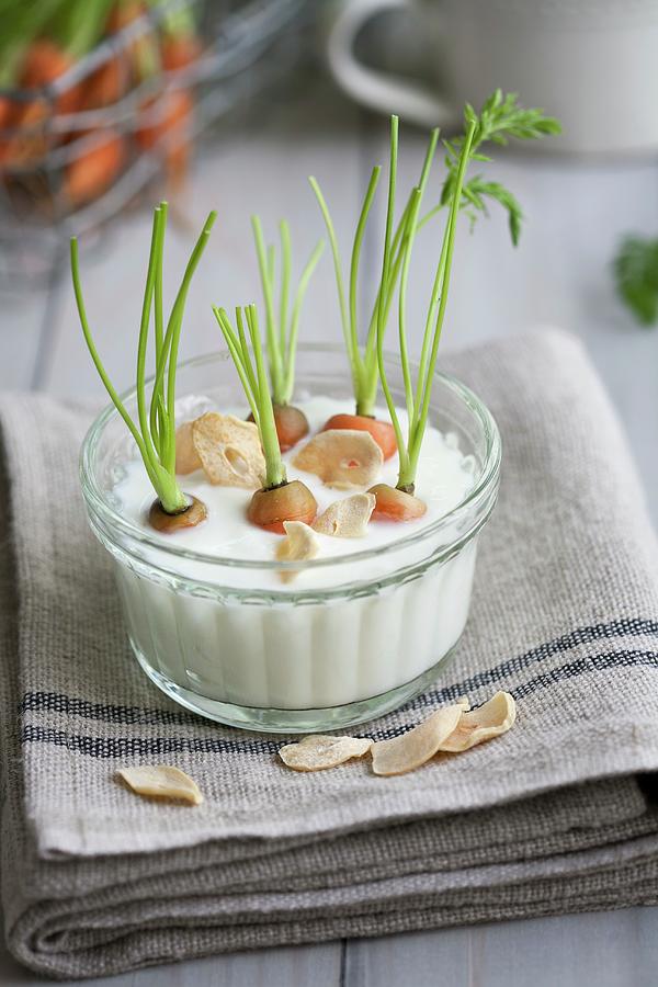 Baby Carrots In Garlic Dip Photograph by Schindler, Martina
