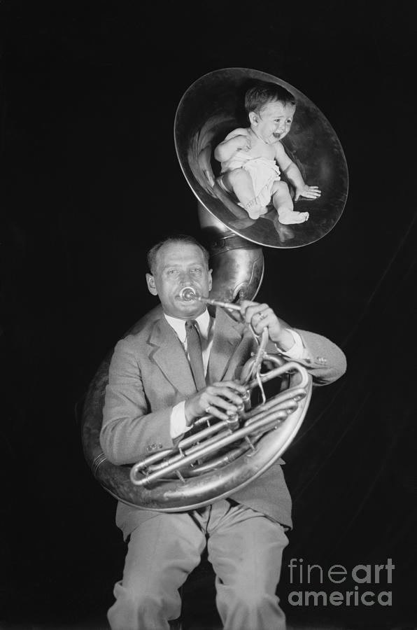 Baby Sitting In Tuba Horn Photograph by Bettmann