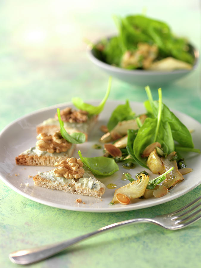 Baby Spinach And Sliced Artichoke Salad With Roquefort Butter On Toasts Photograph by Rivire