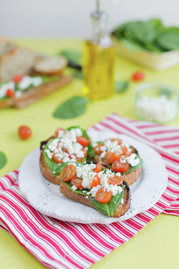 Baby Spinach,feta And Cherry Tomato Open-sandwiches Photograph by Desgages