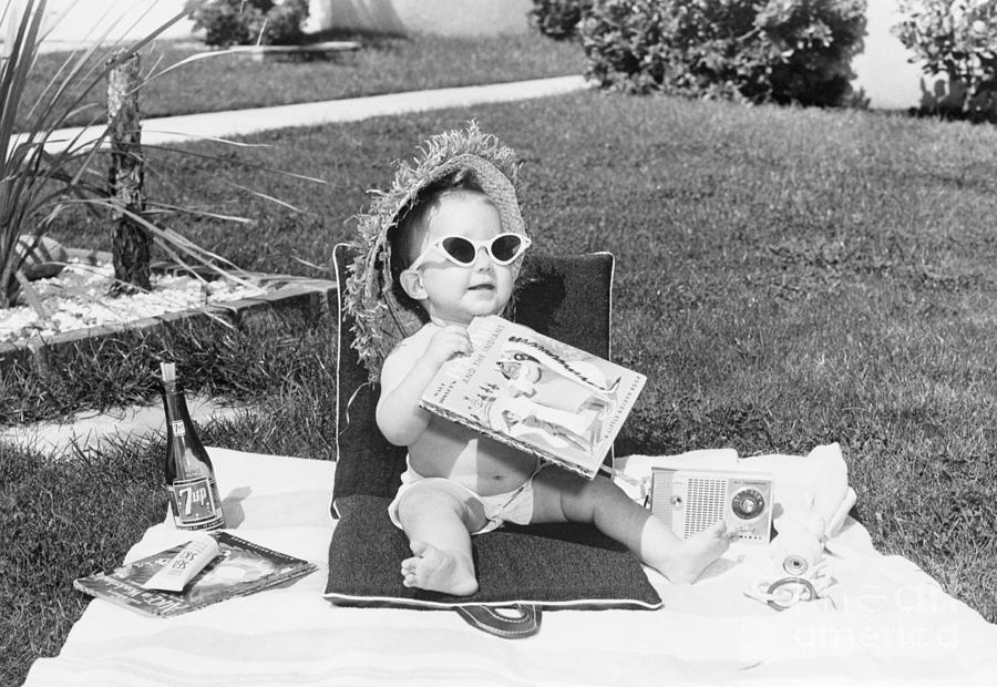 Baby Sunbathing On Lawn Photograph by Bettmann