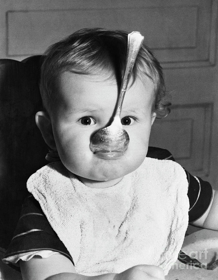 Baby With Spoon In Mouth Photograph by Bettmann