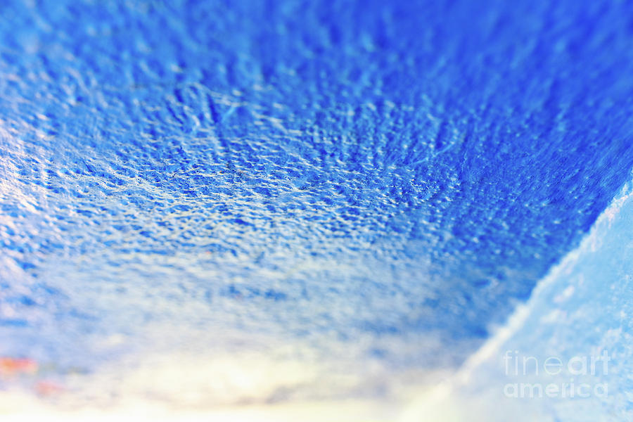 Background with rough texture of a wall painted blue and illumin Photograph by Joaquin Corbalan