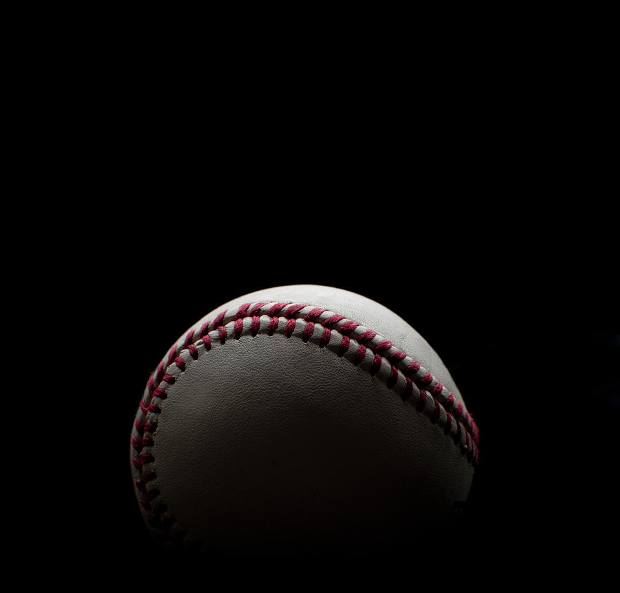Backlit Baseball Shot On A Black Photograph by Courtneyk
