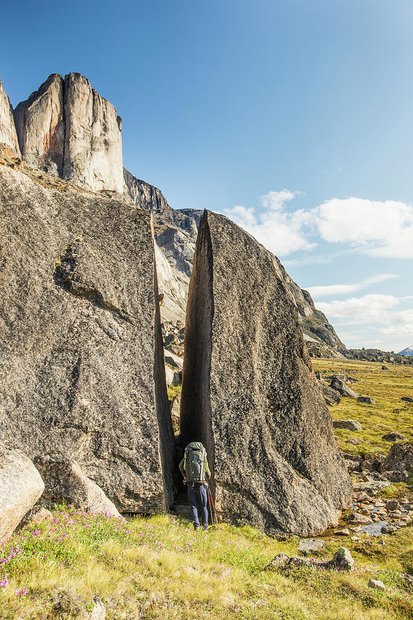 Backpacker Squeezes Through Gap In Cracked Erratic Boulder Photograph ...