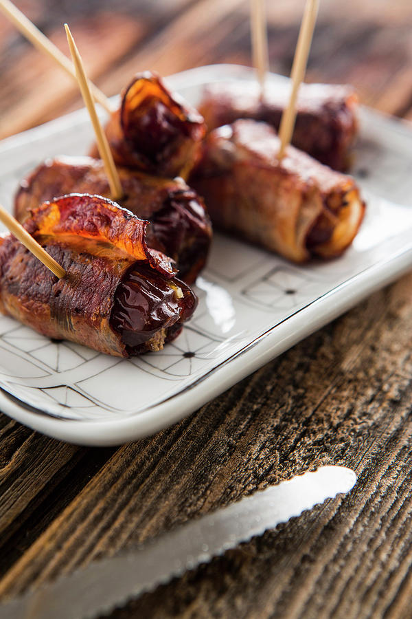 Bacon Wrapped Dates Filled With Cheese Photograph by Sandra Krimshandl-tauscher