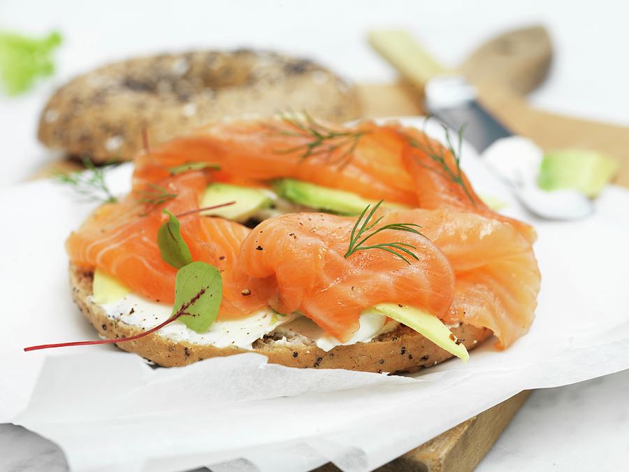 Bagel With Smoked Salmon, Fresh Cheese And Avocado Photograph by Hugh Johnson