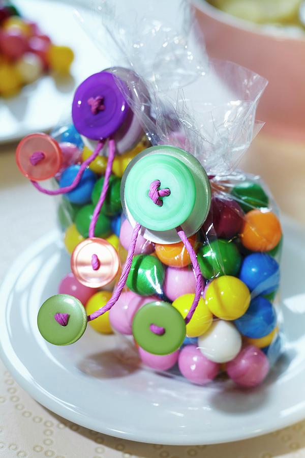 Bags Of Colourful Sweets Decorated With Buttons Photograph by Franziska Taube