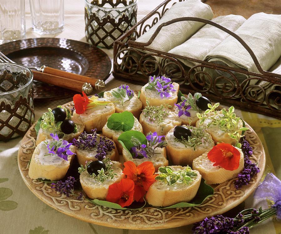 Baguette Appetisers With Herb Leaves And Flowers Photograph by Strauss, Friedrich