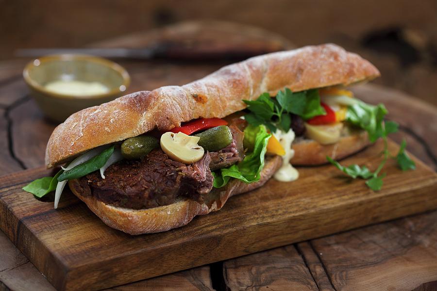 Baguette Sandwich With Beef And Mixed Pickles Photograph by Boguslaw Bialy
