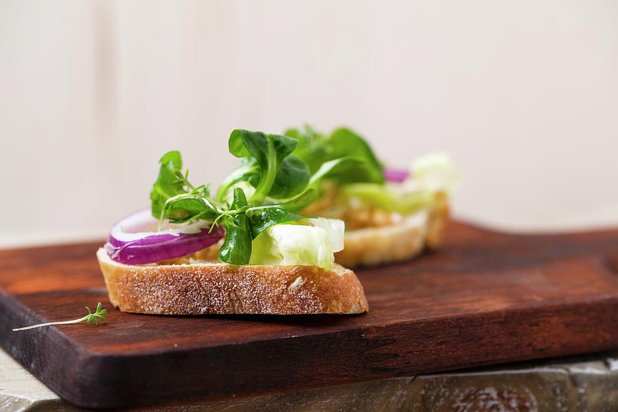 Baguette Slices With Olive Oil And Salad lambs Lettuce, Cress, Onion, Iceberg Lettuce, Einkorn Photograph by Mandy Reschke