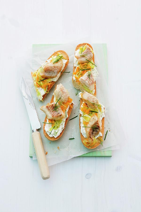 Baguette Topped With Cream Cheese, Pollack, Carrots And Leek Photograph by Michael Wissing