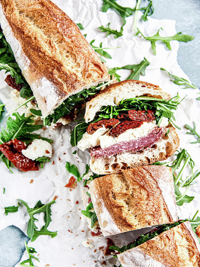 Baguette With Salami, Mozzarella, Dried Tomatoes And Arugula Photograph by Sylvia Meyborg