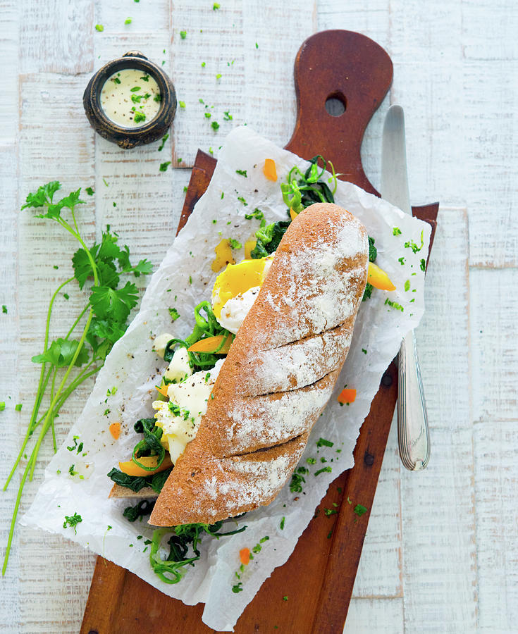 Baguette With Spinach And Eggs Benedict Photograph by Udo Einenkel