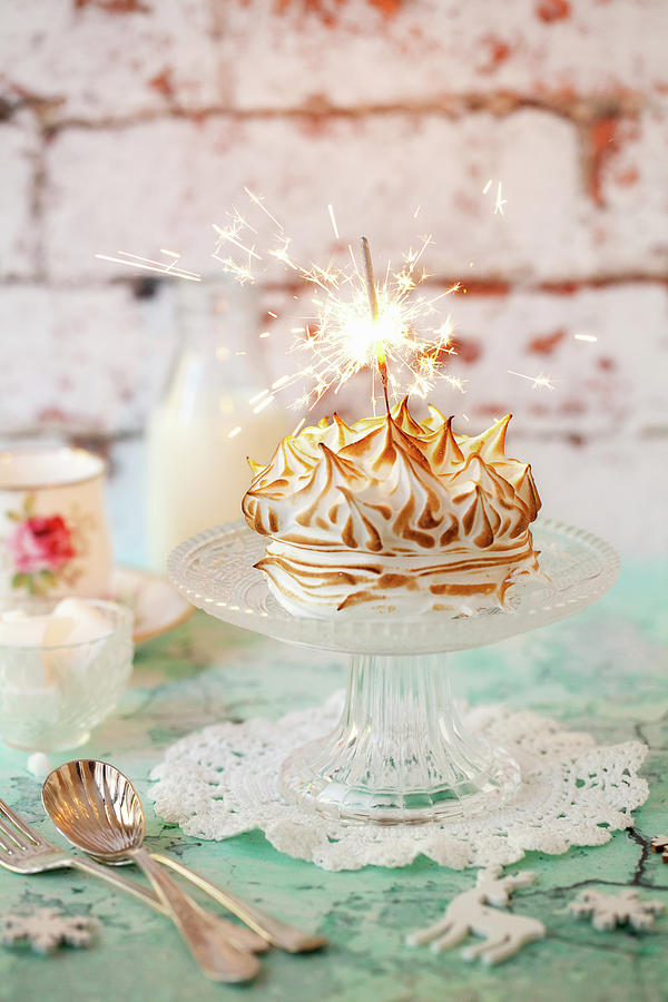 Baked Alaska Cake With A Sparkler Photograph by Jane Saunders