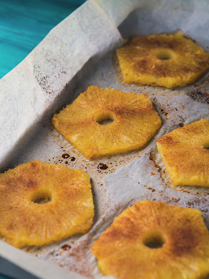 Baked Ananas Slices With Cinnamon, Calvados Liqueur And Brown Sugar On Baking Tray Photograph by Sofya Bolotina