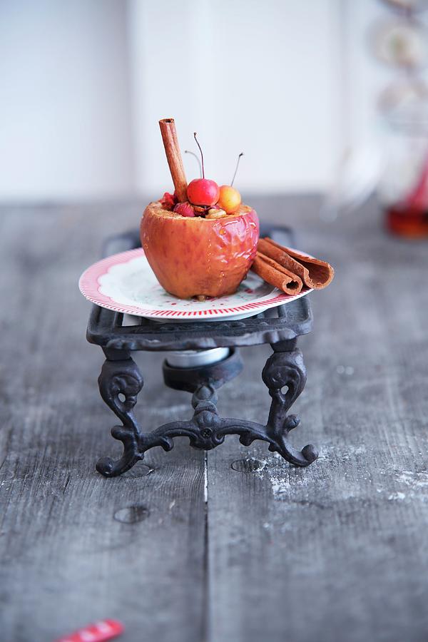 Baked Apple And Cinnamon Stick On Vintage Warmer Photograph by Syl Loves