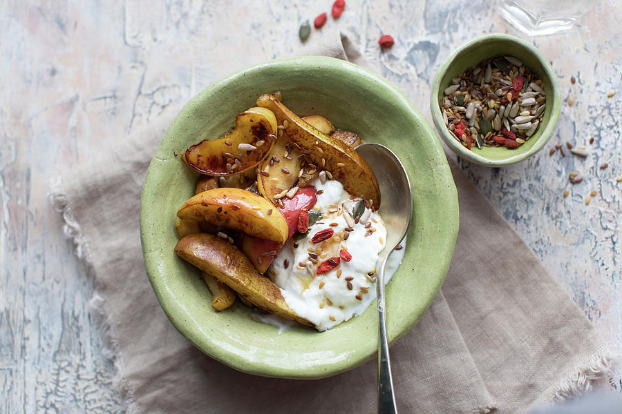 Baked Apple And Pear Slices Served With Yoghurt, Goji And Seeds Photograph by Lara Jane Thorpe