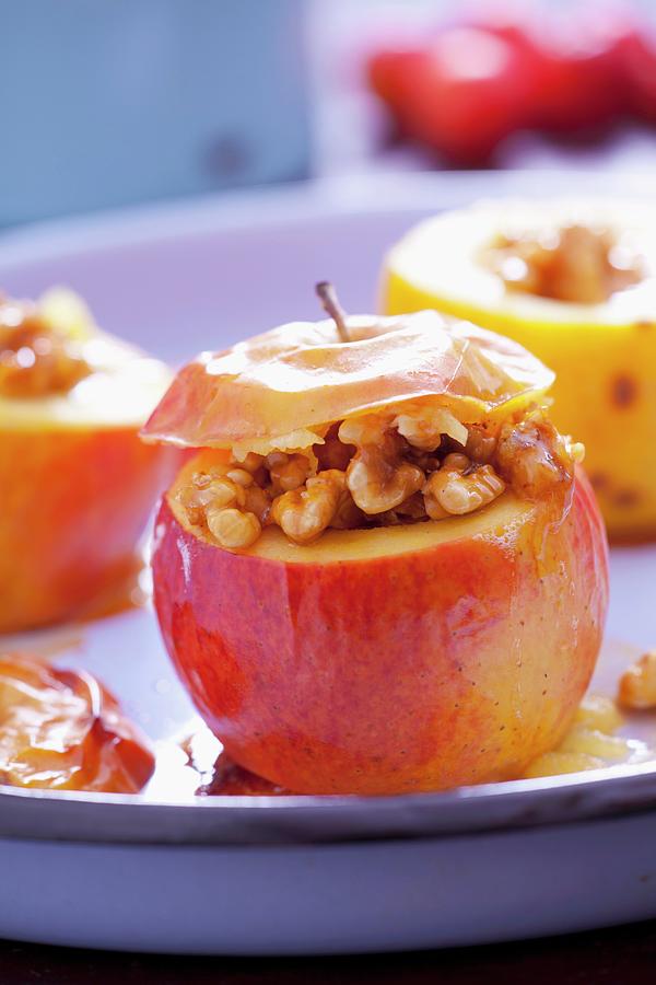 Baked Apples Stuffed With Nuts And Honey Photograph by Studio Lipov