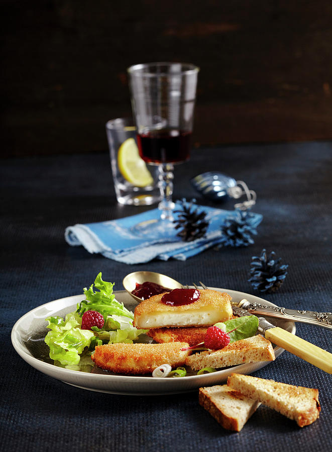 Baked Breaded Goats Cheese With Salad And Raspberry Jam For Christmas Photograph by Teubner Foodfoto
