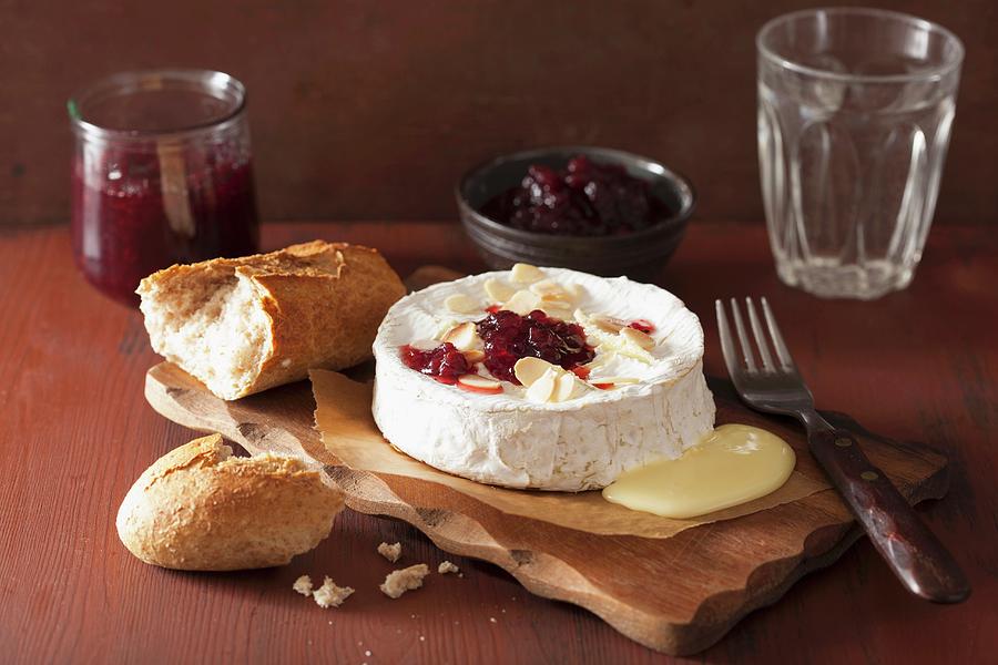 Baked Camembert With Almonds And Cranberry Sauce Photograph by Olga Miltsova
