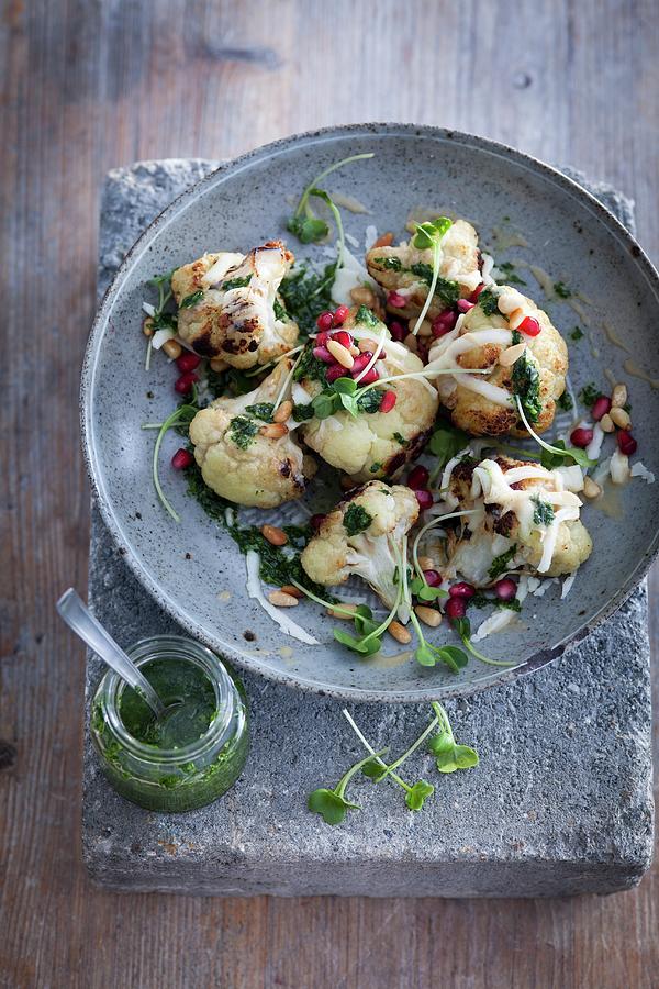 Baked Cauliflower With Pomegranate, Coriander And Parsley Pesto, Cress, Pine Nuts And Tahini Photograph by Eising Studio