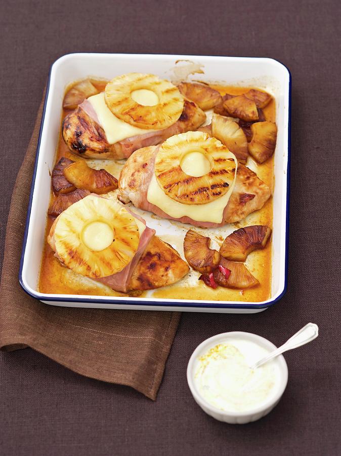 Baked Chicken Breasts Wrapped In Ham Topped With Cheese And Pineapple Photograph by Rua Castilho