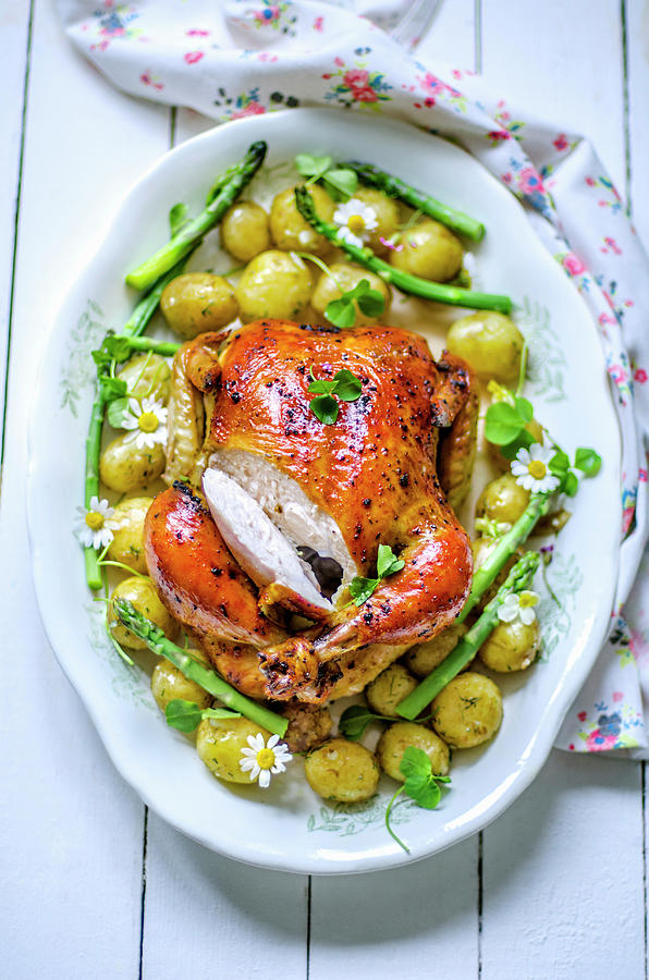 Baked Chicken With Young Potatoes And Asparagus On A Large Dish Photograph by Gorobina