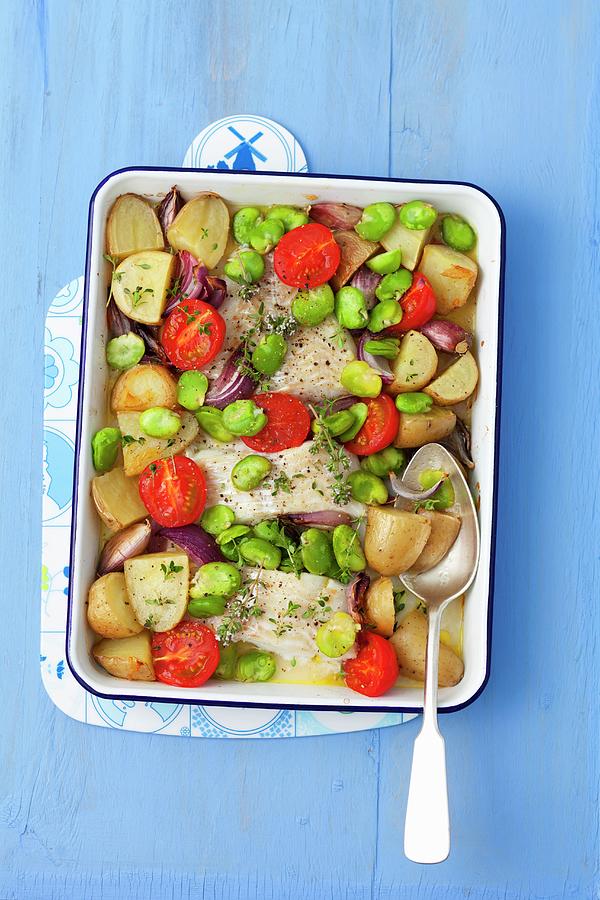 Baked Cod With Potatoes, Broad Beans, Garlic, Onions And Tomatoes Photograph by Rua Castilho