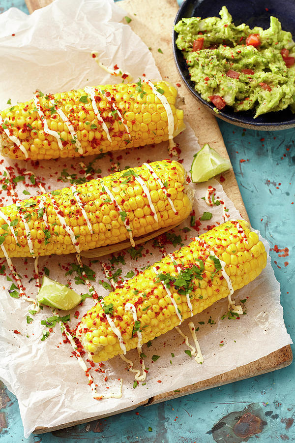 Baked Corn On The Cob With Chili, Parsley And Guacamole Photograph by Maximilian Carlo Schmidt