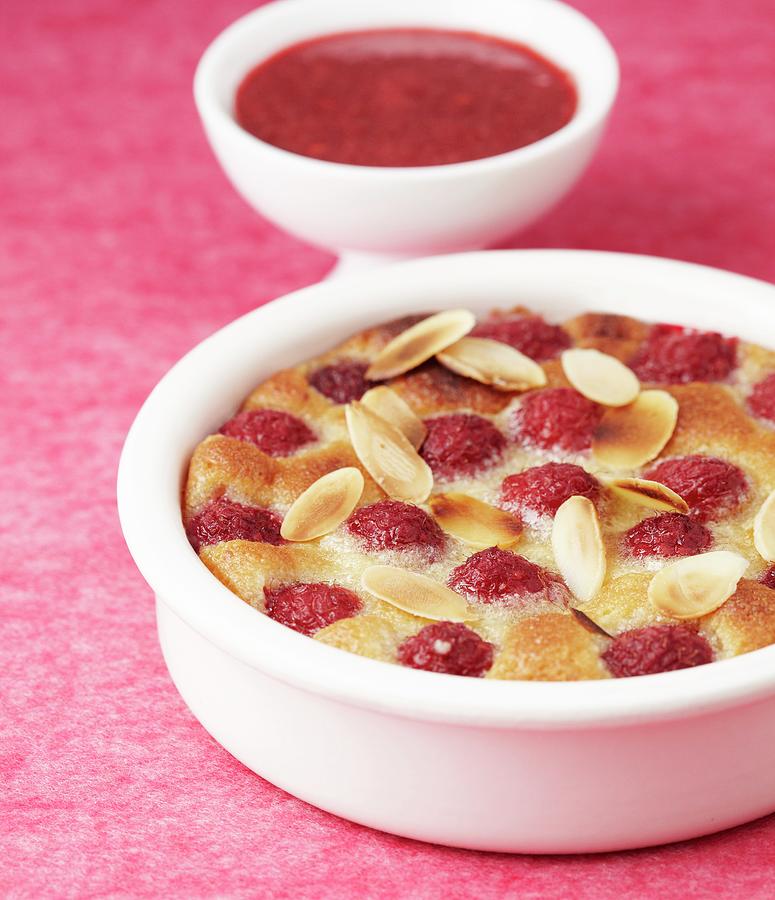 Baked Dessert With Strawberries And Almonds, Served With Cherry Sauce Photograph by Atelier Mai 98